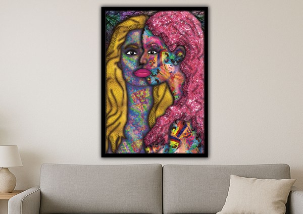 Framed abstract art of two women’s faces merging in vibrant colours and textures, representing feminine energy and connection.