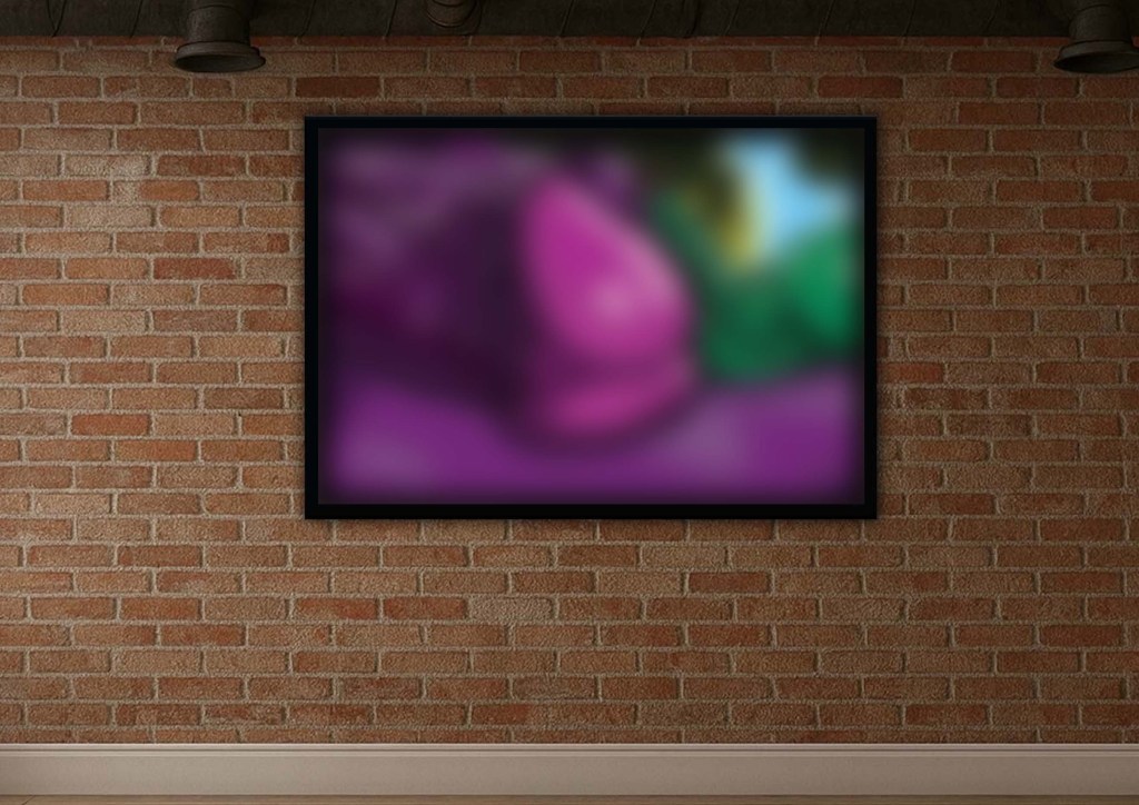 Framed erotic wall art showing two male figures reclining closely together in a lush garden setting, rendered in rich purple and green tones with smooth linework and soft lighting, displayed in a modern interior.