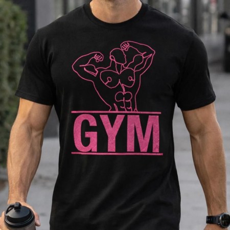 Black gym t-shirt featuring bold muscle line art of a flexing male figure above GYM text in pink and grey variations. Athletic male model wearing fitted black tee in gym and urban street settings. Fitness apparel mockup showing detailed front print, lifestyle wear, and workout styling. Modern minimalist gym shirt designed for bodybuilding, training, and everyday activewear use.